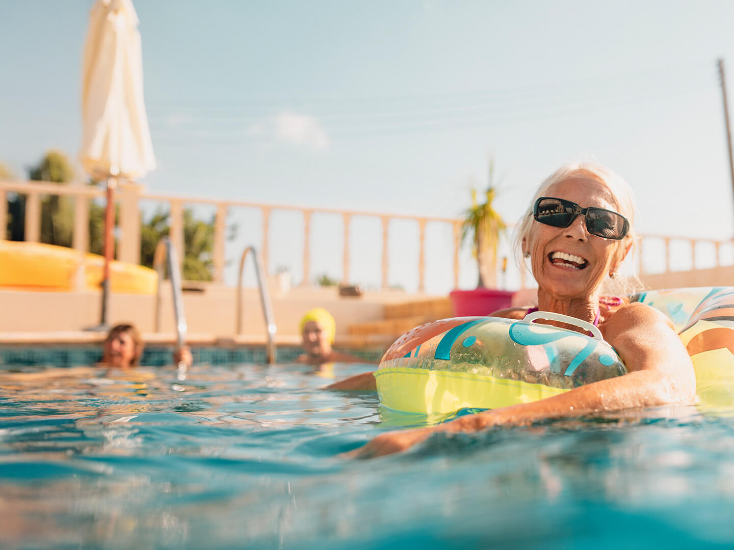 Woman in a pool with a float ring on